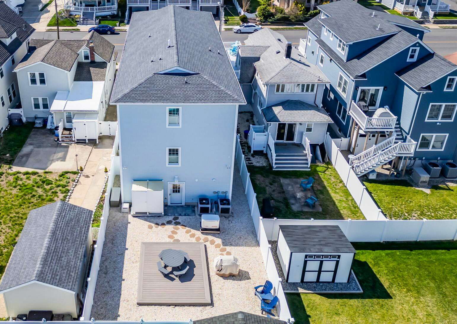 Raised shore cottage with ocean‑facing deck and coastal landscaping
