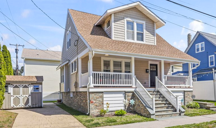 Small beach bungalow with fenced yard and seasonal decorations