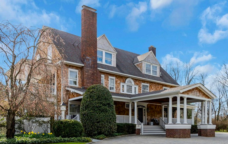 Coastal bungalow near Rumson promenade with elevated foundation and porch