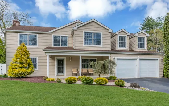 Modern ranch home in Manalapan with finished basement and backyard patio
