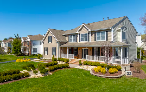 Modern Cranbury home with glass entry and landscaped terraces