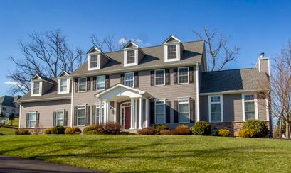Small Flemington bungalow with covered porch and seasonal landscaping