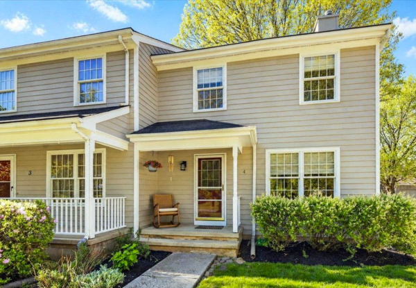 Hopewell stone farmhouse with manicured lawn and private drive
