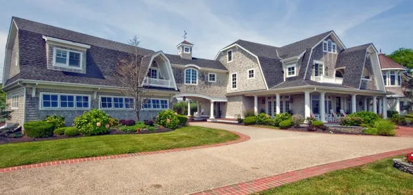 Two‑story beach house in Monmouth Beach with landscaped dune pathway