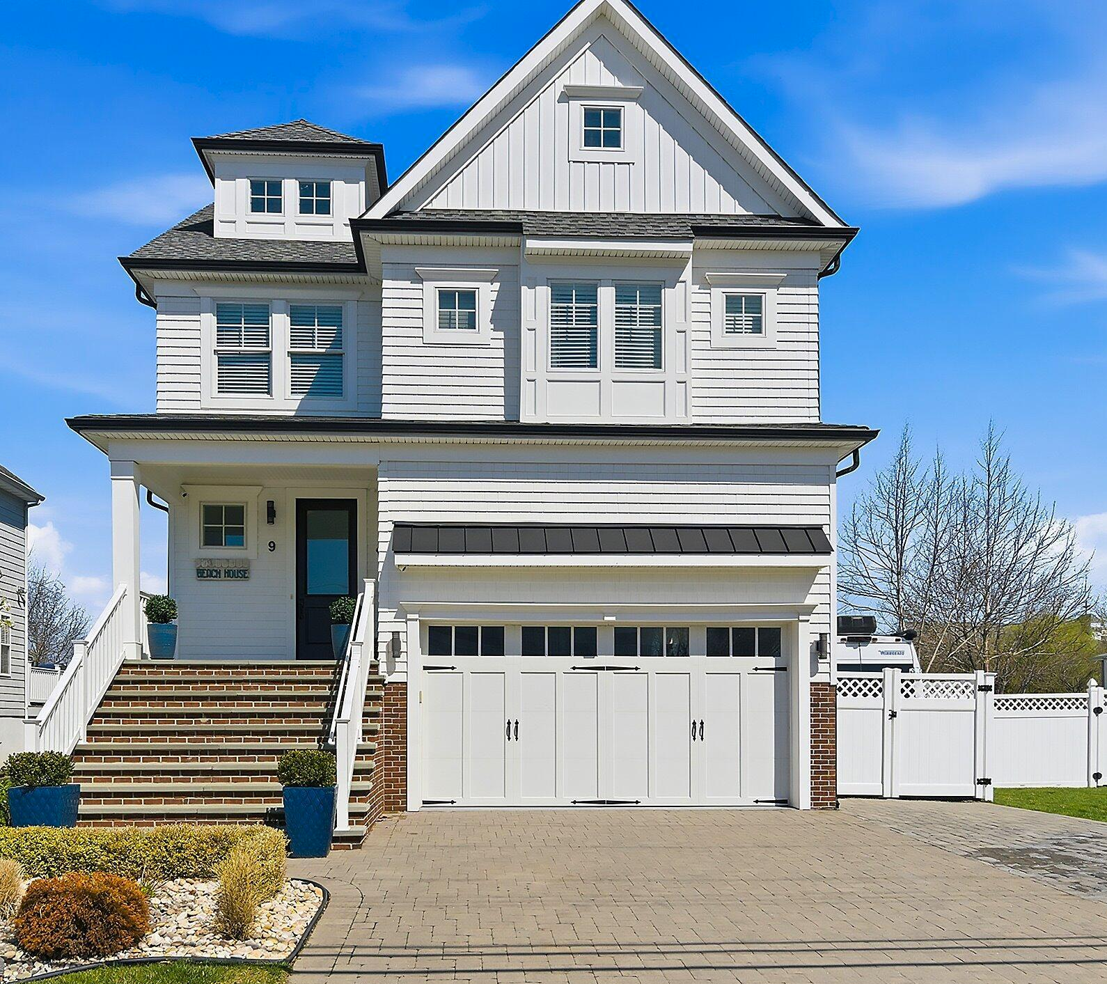 Oceanfront Monmouth Beach home with raised foundation and dune fencing