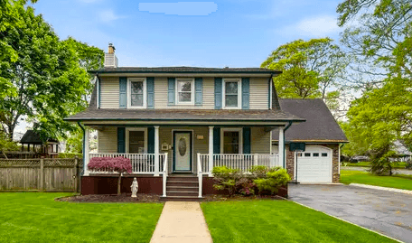 Beautiful tree-lined residential street with luxury homes in Oakhurst New Jersey