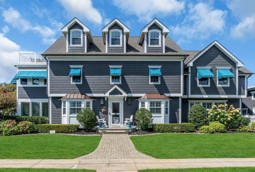 Modern Sea Girt coastal residence with pool, dune fencing, and ocean views