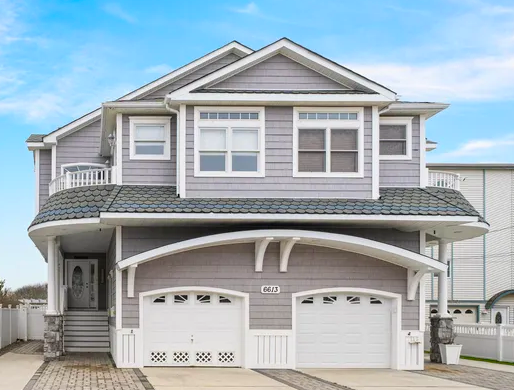 Sea Isle City raised beach house with dune fencing and ocean view