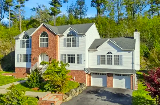 West Milford lakefront cottage with private dock and wooded shoreline