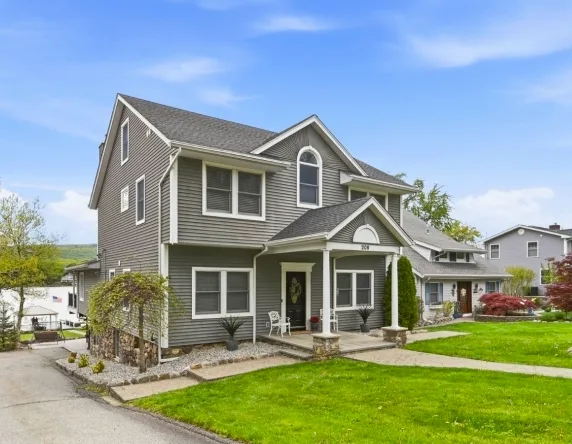 Ranch‑style home near West Milford park with landscaped yard and patio