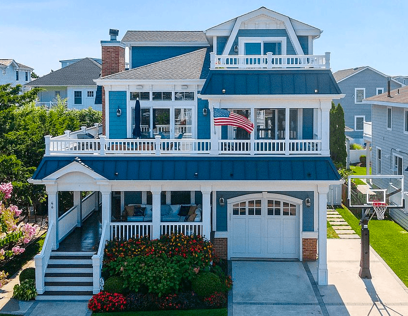 Luxury Avalon shingle-style beachfront home with coastal landscaping and ocean views