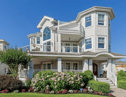 Modern custom coastal home near Townsend Inlet with elevated pilings and custom decks