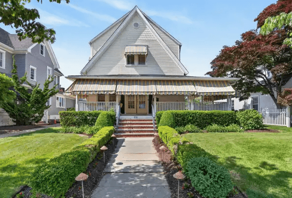 Avon-by-the-Sea NJ shingle-style estate with cedar shake roof and oceanfront dune fencing